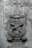 Left portal relief, Franciscan insignia