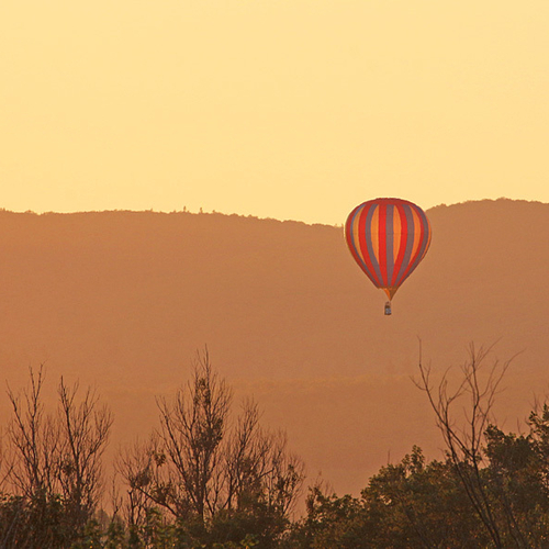 A single hot-air balloon rises up from the misty depths of Princess Louise Park @ Sussex, New Brunswick, Canada.