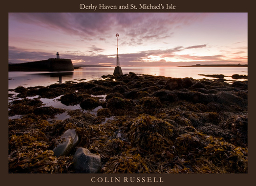 Dawn at low tide at the entrance to Derby Haven with St. Michael's Isle with its Fort and Chapel silhouetted against…