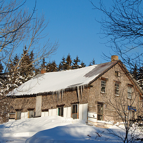 An old barn endures yet another winter in rural Kings County, New Brunswick, Canada.