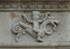 Façade architrave relief, putto aloft hippocamp