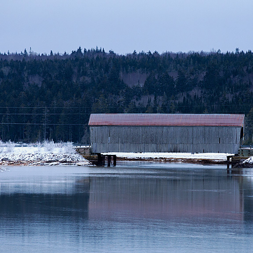 Tynemouth Creek reflecting it's historic wooden covered bridge.