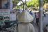 Woman wearing conical hat in Cambodia.