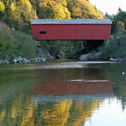 The most colorful of New Brunswick's remaining covered bridges is set within a scenic and forested river valley.
