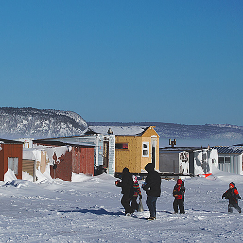 A family of five arrives for a day of ice fishing at the Renforth Wharf along the banks of the Kennebecasis River in…