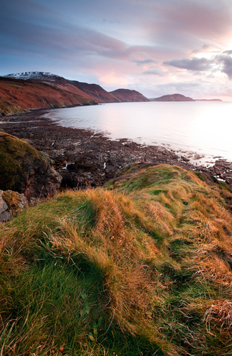 The stunning South West coast of the Isle of Man catching the last rays of a December day. The remains of the Novembe…