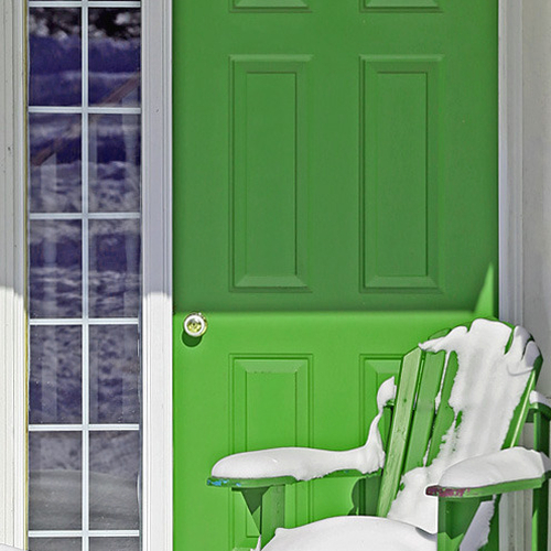 A green Adirondack / Muskoka / Laurentian chair just after a blizzard.