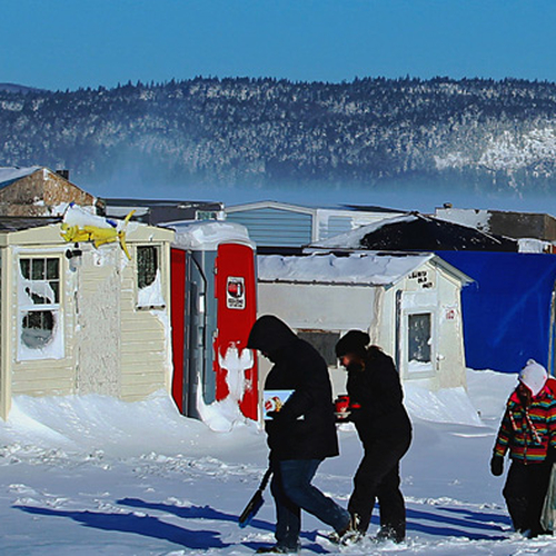 A family arrives for a day of ice fishing, the morning after a winter storm ~ Rothesay, NB, Canada