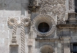 Façade details, oculus & Franciscan cord (left)