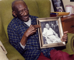 Reverend H.D. Dennis Holding Portrait of Margaret, Mississippi, 2011
