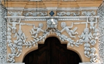 Façade, mixtilinear portal & spandrel relief