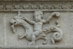 Façade architrave relief, putto aloft hippocamp