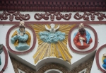 Façade window reliefs, SS Peter, Paul & Holy Ghost