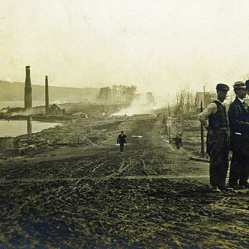 The Great Campbellton Fire destroyed all but a few buildings. Here we see a few town folk surveying the devastation o…