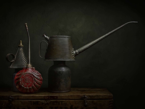 The Shell Oil Can. Light-painted still-life photograph featuring vintage oil cans and including a fluted Shell can.…
