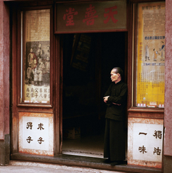 KM-264 Man in old medicine shop in Hollywood Road - 1974