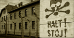 Auschwitz Halt sign and building sepia