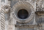 Façade details, oculus & Franciscan cord (left)