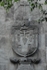 Right portal relief, Franciscan insignia