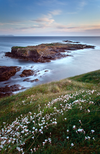 The 'Tail of the Rocks' at Niarbyl on a breezy evening. This image exposed for one minute to give that soft sea feel.