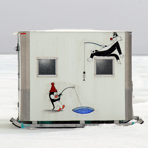 A cartoonish, animated scene adorns this ice shack along the St. John River in New Brunswick, Canada.