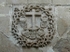 Large cloister, lower walk spandrel insignia