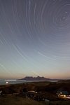 Star trails over Rum from Cleadale, Isle Of Eigg