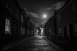 Moonlight and street lamps.