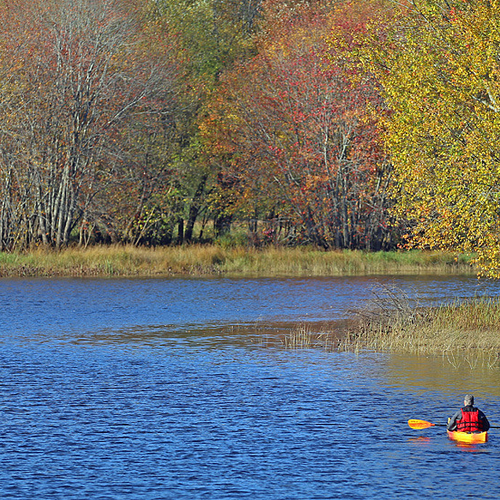 A lone kayaker sets out along the Hammond River near Darlings Island, Kings County, New Brunswick.