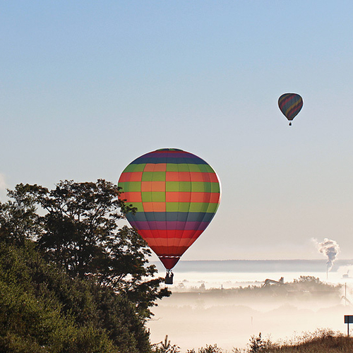 Early morning land fog encapsulates the Kennebecasis Valley as balloons attempt to rise upward and onward.