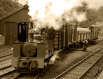 WLLR Dougal leaves Llanfair Station with mixed goods sepia