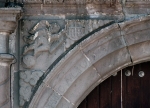 La Asunción de Nuestra Señora, façade portal, left spandrel relief