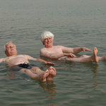 Smiling and floating on the Dead Sea, Israel