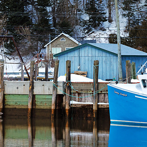 A close-up composition of the wharf and near shore fishing vessel @ St. Martins, NB, Canada.