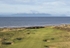 Aerial view of the 10th hole and snow-tipped Arran
