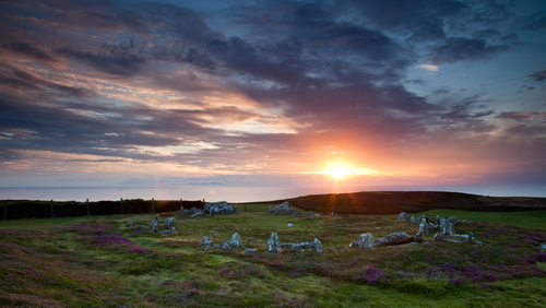 The neolithic/early bronze age circle of burial chambers and mounds at Meayll Hill looking out towards the Mourne Mou…