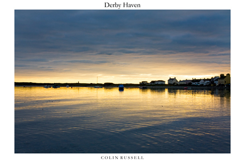 January golden light creeping under a blanket of cold grey cloud at Derby Haven