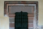 Lower cloister ambulatory, portal with painted alfiz