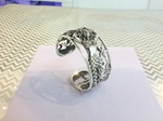 Silver mermaid design bangle.   £340.00