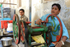 India Porbandar boys with sugar cane squeezer