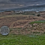 A view of cruit island golf course club house with aran mor in the bac