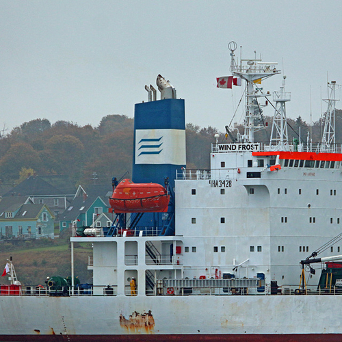 A macro of the refrigerated cargo ship, Windfrost with Eastport, Maine visible in the background.