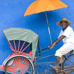 Smiling man on rickshaw Panang Malaysia