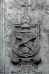 Left portal relief, Franciscan insignia