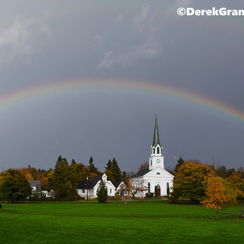 A rainbow encircles St. Paul's Anglican Church and the Common in Rothesay, New Brunswick, Canada.