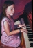 Girl in pyjamas on a piano