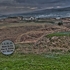 A view of cruit island golf course club house with aran mor in the bac