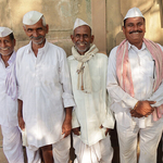 Five smiling men in Nerhu style Cloths India