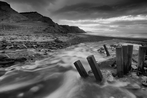 The river and Beach at Glen Mooar looking south towards Peel Head and Castle.