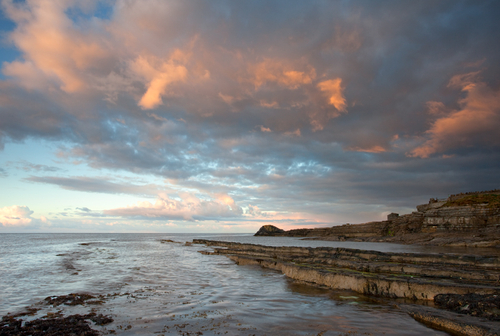 Dawn at Scarlett, near to Castletown, and a firery sky erupts over the old volcanic rocks.